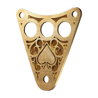 Isolated image of a decorative Kawasaki Vulcan 800 dash plaque made out of raw brass.
